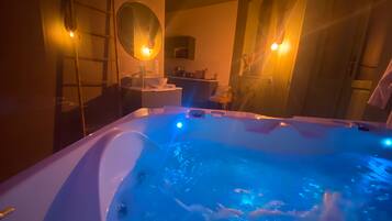 Romantic Apartment | Bathroom | Jetted bath, rainfall showerhead, hair dryer, bathrobes