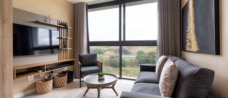 Deluxe Apartment | Living area | Flat-screen TV, Netflix, streaming services