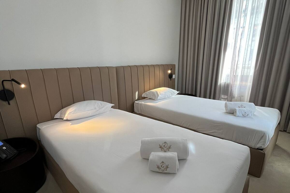 Double or Twin Room | Hypo-allergenic bedding available, minibar, in-room safe