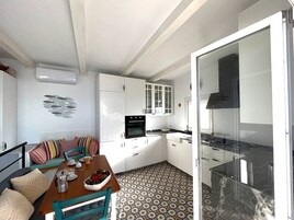 Family Apartment | Private kitchen | Full-size fridge, microwave