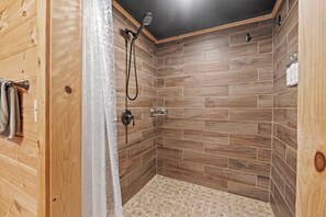 Bathtub, eco-friendly toiletries, hair dryer, towels