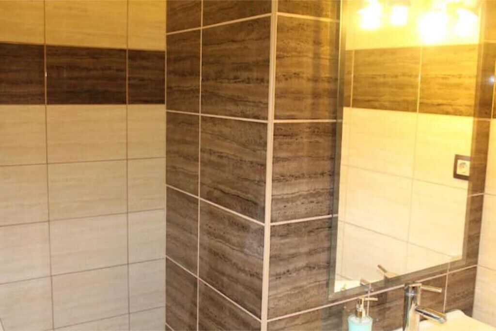 Shower, hair dryer, towels, toilet paper