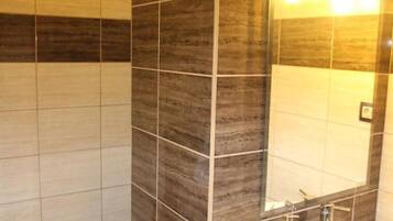 Shower, hair dryer, towels, toilet paper