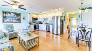 A spacious living area with a kitchen, dining table, and chairs. - Walk to Beach & Pier: Quiet Retreat in Surf City (Surf City)