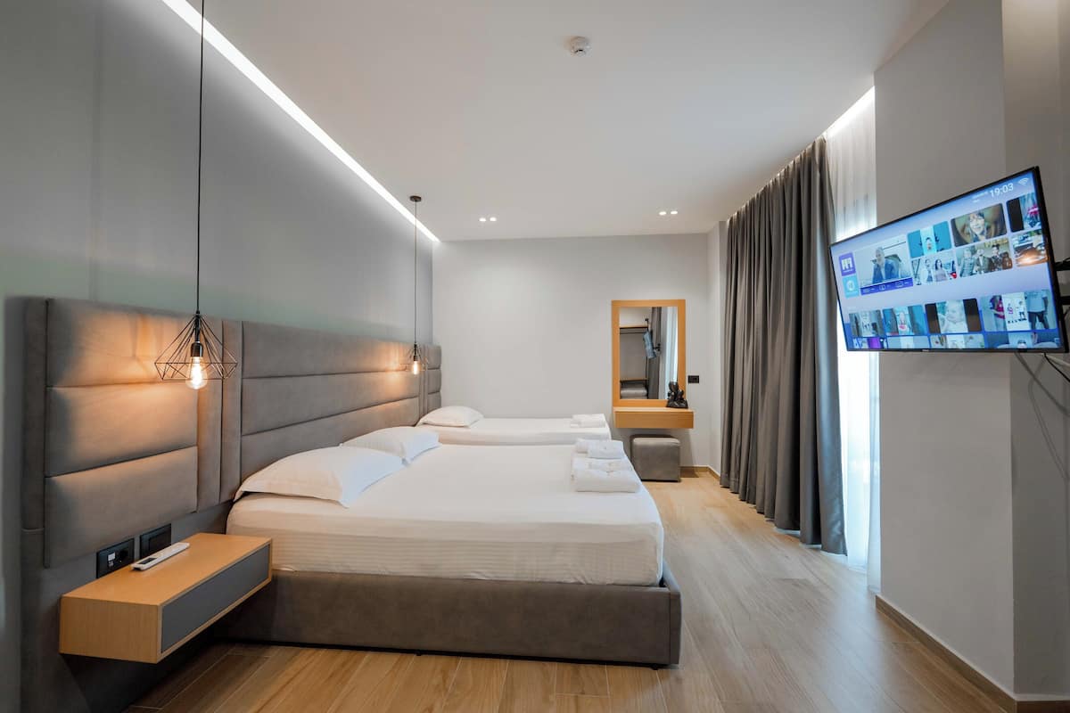 Comfort Triple Room, Balcony | Desk, soundproofing, iron/ironing board (on request), cribs (free)