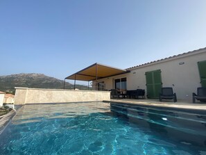 Outdoor pool, a heated pool - Comfortable 8-person villa with pool and sea view (LUMIO)