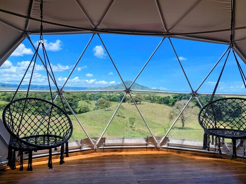 Luxurious Dome set on hillside with views to a lagoon, the ocean and mountains