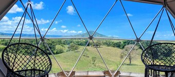Luxurious Dome set on hillside with views to a lagoon, the ocean and mountains