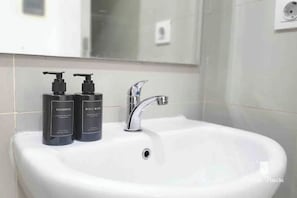 Hair dryer, towels, soap, shampoo