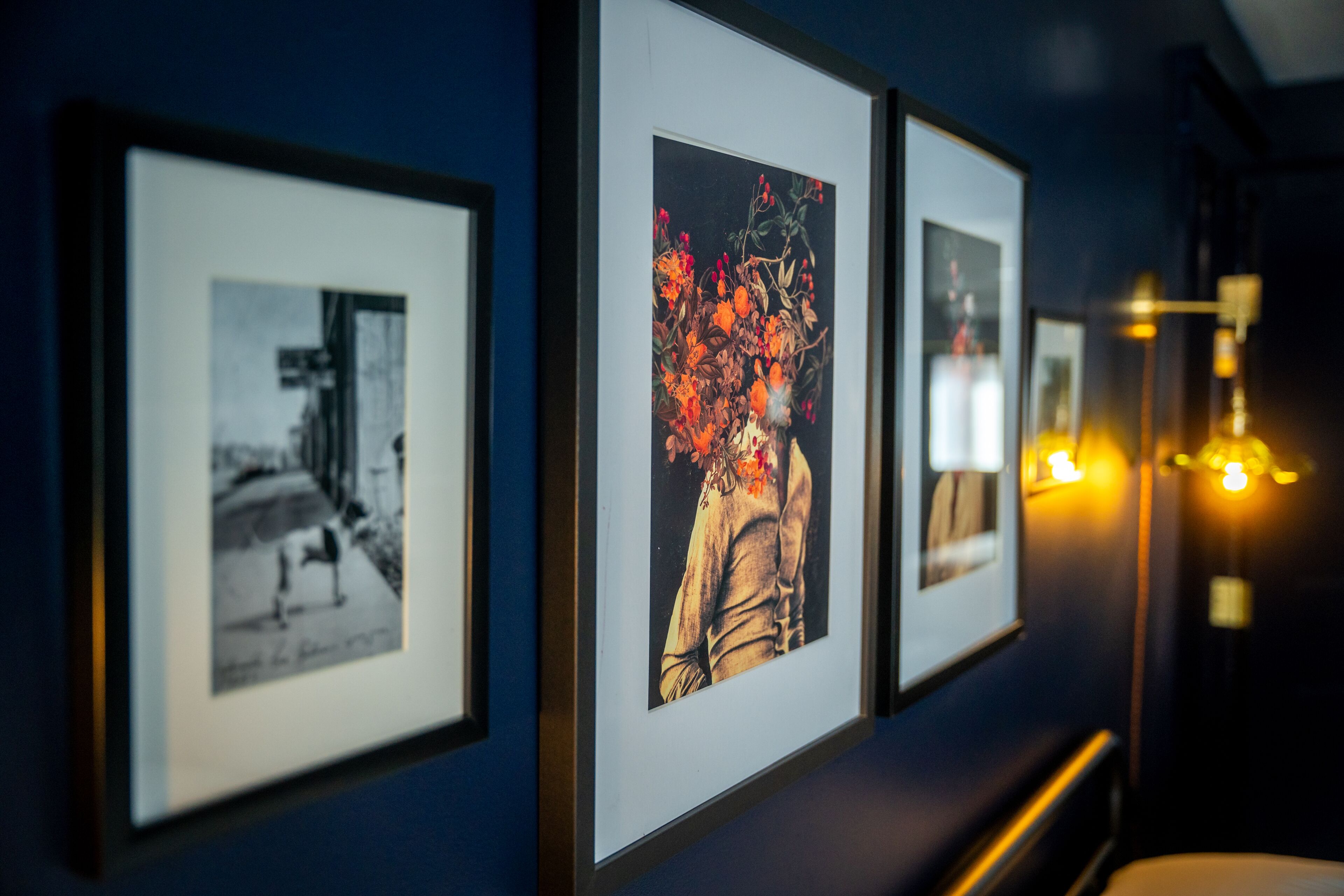 Framed artwork on a wall in a hallway.