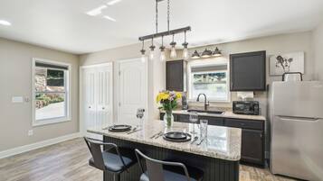 Fridge, microwave, stovetop, coffee/tea maker