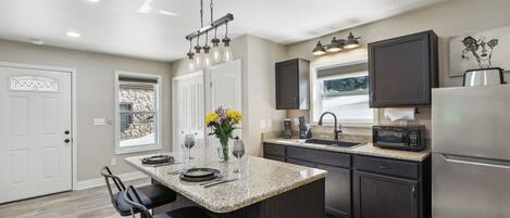 Fridge, microwave, stovetop, coffee/tea maker