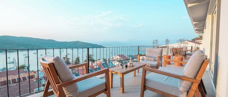 Superior Apartment | Living area | 82-inch Smart TV with satellite channels, heated floors