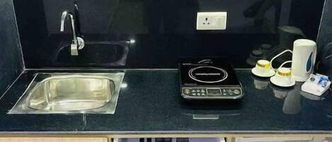 Fridge, microwave, stovetop, coffee/tea maker