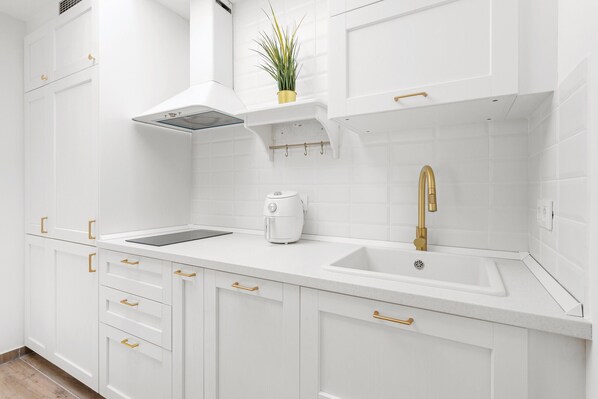 Fridge, coffee/tea maker, electric kettle, cookware/dishes/utensils