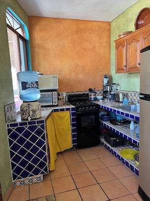 Enjoy cooking in this well-equipped kitchen with a gas stove, microwave, and coffee maker.