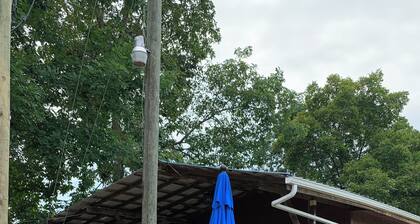 Cozy 2-bedroom cabin with view of Millcreek in and a private dock.