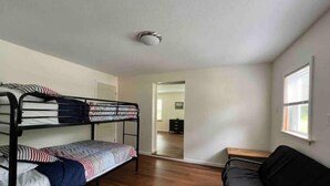 A room with bunk beds, a desk, and a window. - Cozy Country Home for all ATV Riders! Direct Access to Tackett and Royal Blue! (LaFollette)