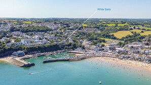 An aerial view of a coastal town with a marina, beach, and residential areas. - White Sails - Beach and Harbour Views (Saundersfoot)