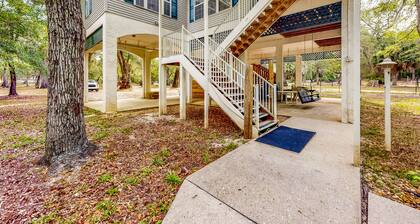 Beautiful, waterfront log home with nature views, woodstove, balcony, & patio