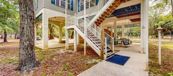 Beautiful, waterfront log home with nature views, woodstove, balcony, & patio