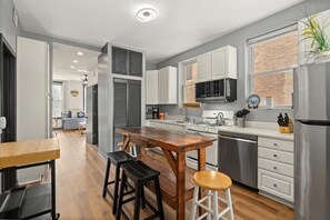 Fridge, microwave, oven, stovetop - REMODELED Splendid Flat in Bucktown +Back Porch, Ranked GUEST FAVORITE! Pets OK! (Chicago)