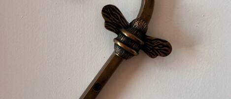 A decorative metal number 2 sign with a bow.
