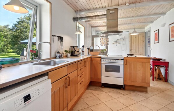 Fridge, stovetop, dishwasher, coffee/tea maker