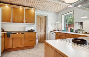 Fridge, stovetop, dishwasher, coffee/tea maker