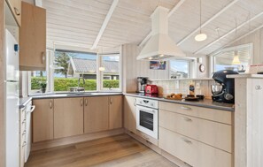 Fridge, stovetop, dishwasher, coffee/tea maker