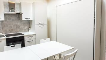 Fridge, oven, dining tables