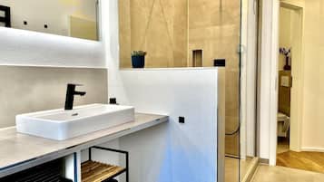 Shower, eco-friendly toiletries, hair dryer, towels