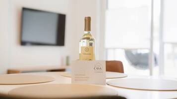 A bottle of Valmarnone wine on a table with a welcome sign for La Mia Casa.