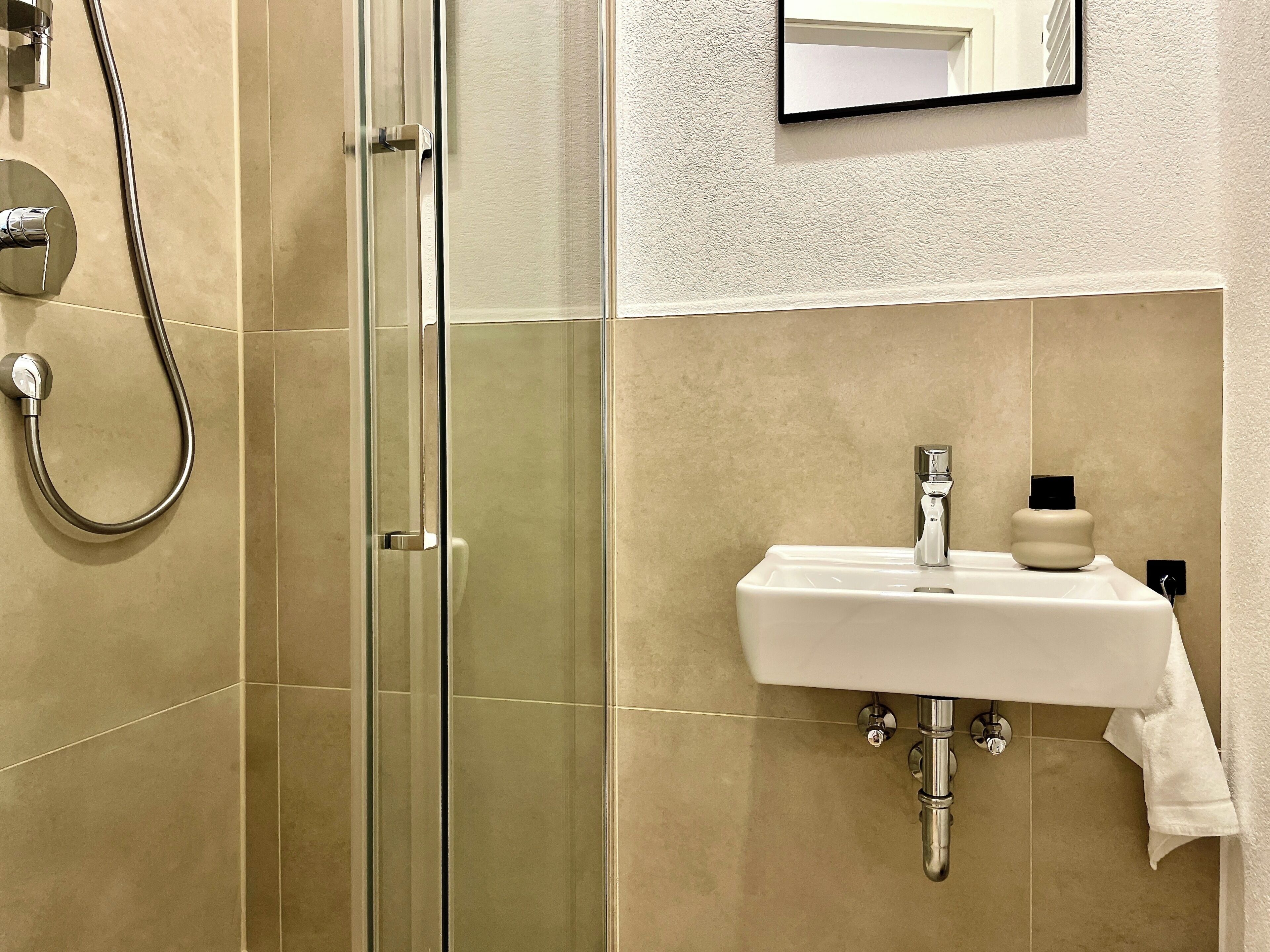 Shower, eco-friendly toiletries, hair dryer, towels