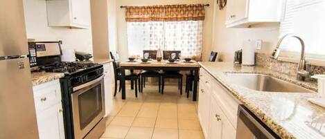 Fridge, microwave, stovetop, cookware/dishes/utensils
