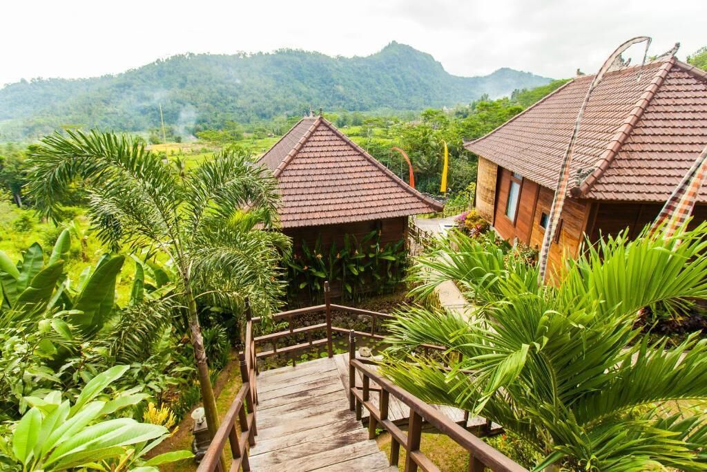 Chambre Double Deluxe, 1 chambre, balcon, vue montagne | Coin séjour | Télévision à écran plat de 15 pouces avec chaînes numériques