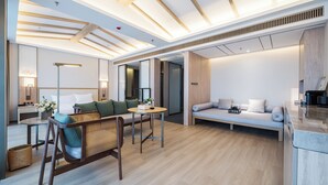 A modern hotel room with a wooden ceiling, a sofa, a dining area, and a large mirror. - HENTIQUE MANNA TANGSHAN (Nanjing)