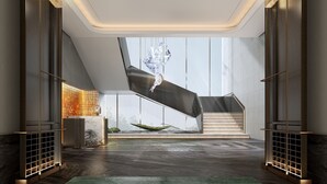 A modern interior with a staircase, a glass wall, and a decorative light fixture. - Cordis, Xuzhou (Xuzhou)