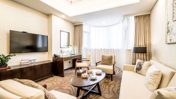 Standard Suite | Living room | 50-inch TV with cable channels