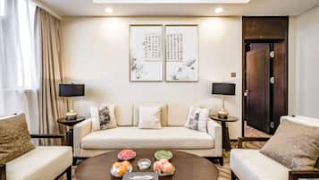 Standard Suite | Living room | 50-inch TV with cable channels