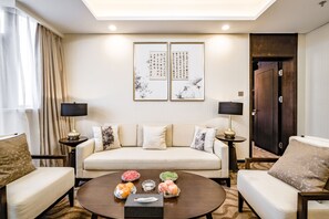 Standard Suite | Living room | 50-inch TV with cable channels