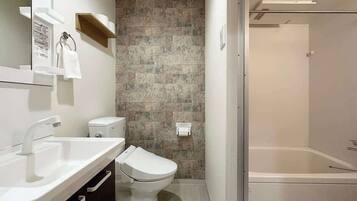 Bathtub, hair dryer, towels