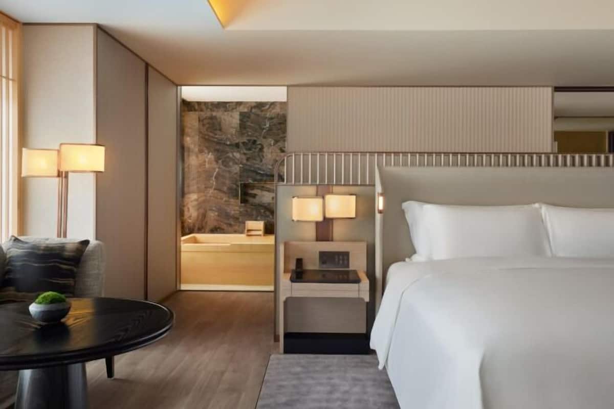 Premium bedding, down duvets, free minibar items, in-room safe
