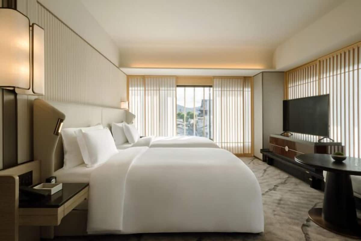 Premium bedding, down duvets, free minibar items, in-room safe