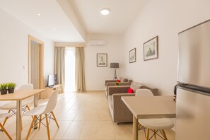40-inch flat-screen TV with satellite channels - The Perfect Spot Apartments (Rhodes)