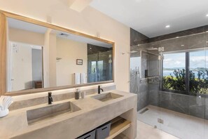 Shower, hair dryer, towels, shampoo