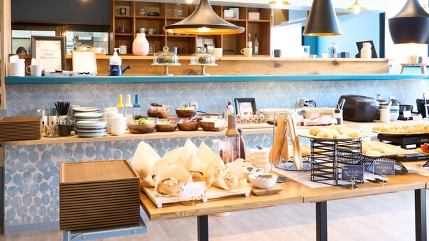 A breakfast buffet with various food items and a coffee station. - STATION Tajima (Asago)