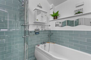 Bathtub, hair dryer, towels