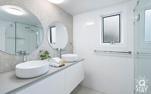 Bathtub, hair dryer, towels, soap