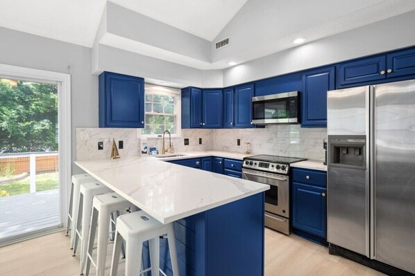 Fridge, oven, coffee/tea maker, cookware/dishes/utensils